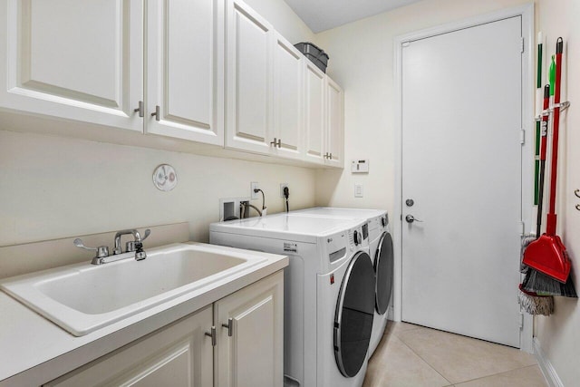11952 Fox Hill Cir, Boynton Beach, FL 33473 - laundry room with cabinet space, washing machine and clothes dryer, and light tile patterned floors