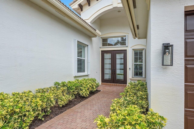 11952 Fox Hill Cir, Boynton Beach, FL 33473 - view of exterior entry with french doors and stucco siding