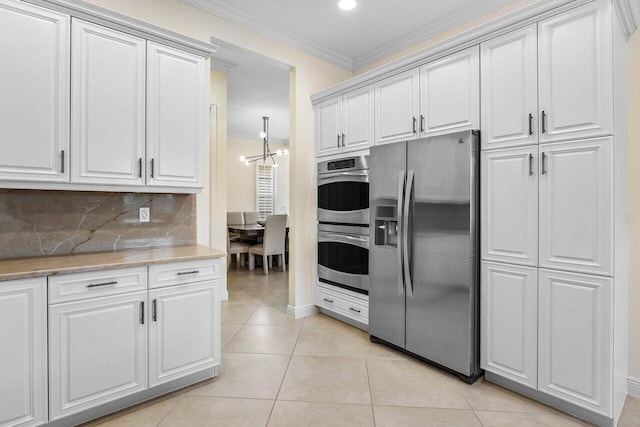 11952 Fox Hill Cir, Boynton Beach, FL 33473 - kitchen featuring appliances with stainless steel finishes, crown molding, light tile patterned flooring, decorative backsplash, and recessed lighting