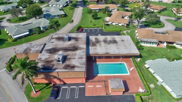 birds eye view of property with a residential view