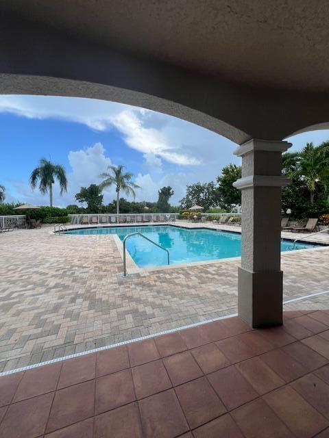 community pool with a patio area