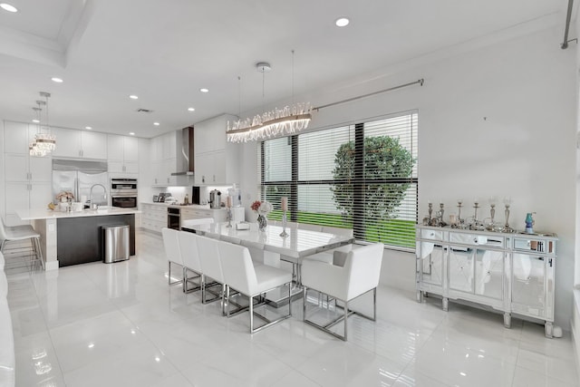 dining space with light tile patterned flooring, a notable chandelier, and recessed lighting