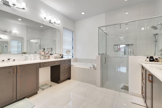 bathroom featuring a bath, vanity, a shower stall, and recessed lighting