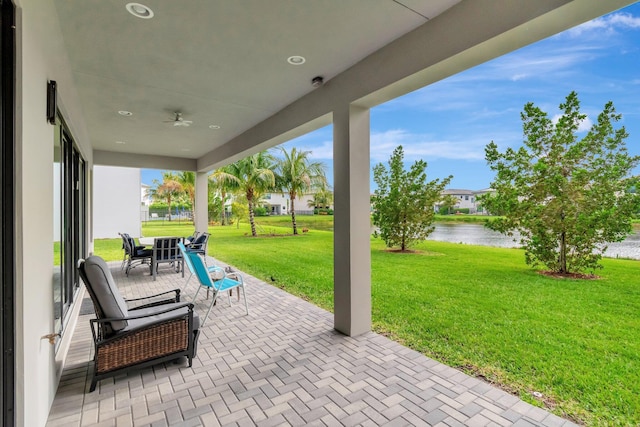 view of patio / terrace featuring a water view and outdoor dining area