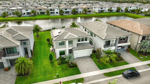 aerial view featuring a water view and a residential view