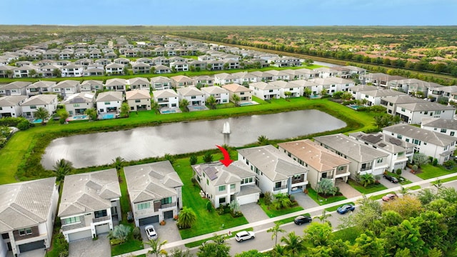 bird's eye view featuring a water view and a residential view