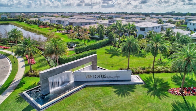 birds eye view of property featuring a water view and a residential view