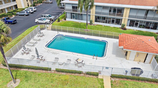 pool featuring fence private yard, a gate, and a yard