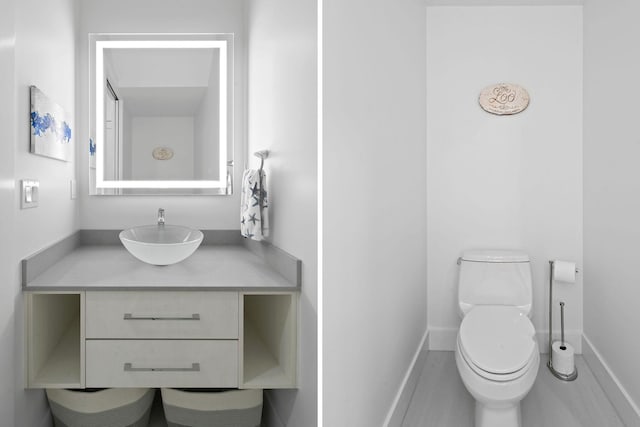 4707 SE Manatee Way, Stuart, FL 34997 - half bath with toilet, baseboards, and vanity
