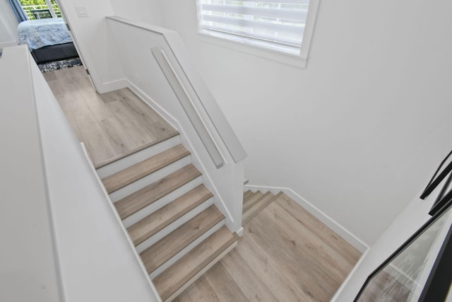 4707 SE Manatee Way, Stuart, FL 34997 - staircase with baseboards and wood finished floors
