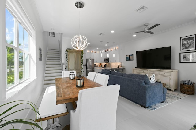 4707 SE Manatee Way, Stuart, FL 34997 - dining space with visible vents, plenty of natural light, ceiling fan with notable chandelier, and stairway