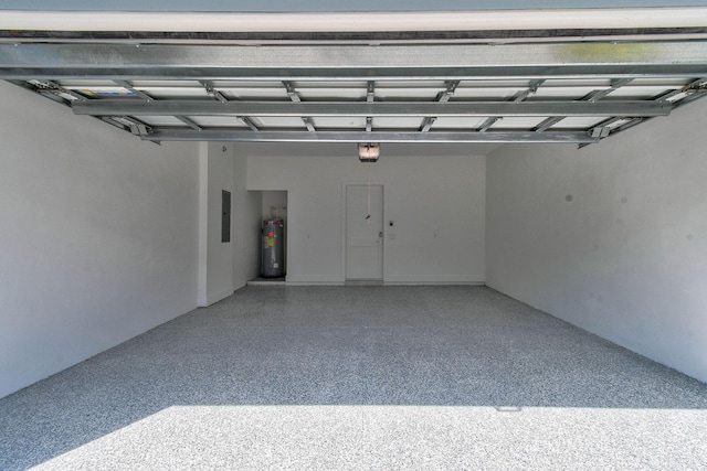 4707 SE Manatee Way, Stuart, FL 34997 - garage featuring a garage door opener, water heater, and electric panel