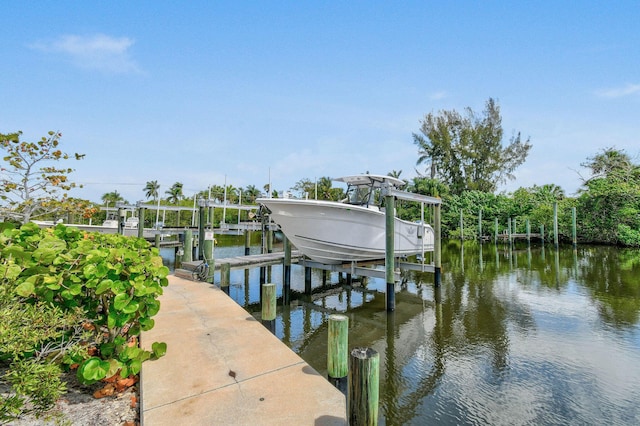 4707 SE Manatee Way, Stuart, FL 34997 - view of dock with a water view and boat lift