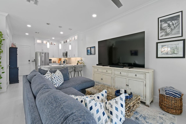 4707 SE Manatee Way, Stuart, FL 34997 - living area featuring crown molding, concrete flooring, recessed lighting, and visible vents