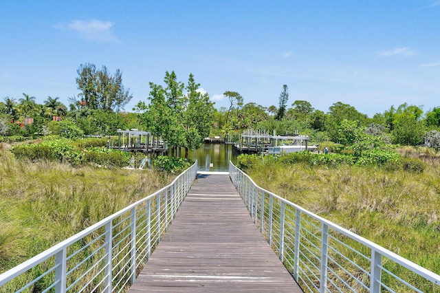 4707 SE Manatee Way, Stuart, FL 34997 - view of dock featuring a water view