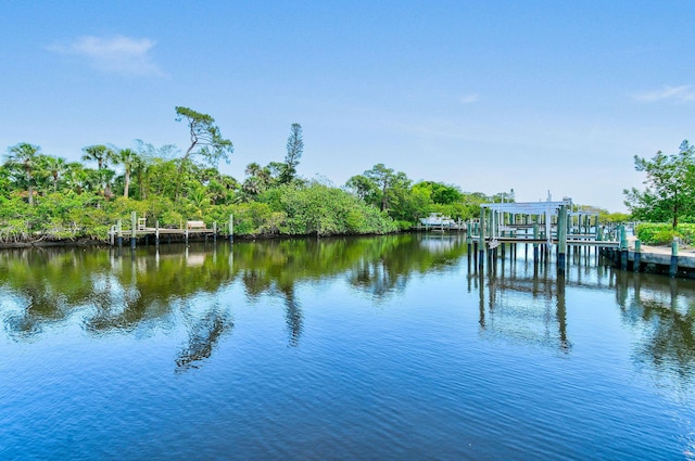 4707 SE Manatee Way, Stuart, FL 34997 - view of dock with boat lift and a water view