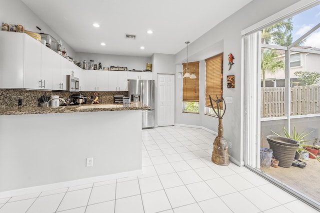 7997 Lakewood Cove Ct, Lake Worth, FL 33467 - kitchen featuring decorative light fixtures, visible vents, appliances with stainless steel finishes, a peninsula, and recessed lighting