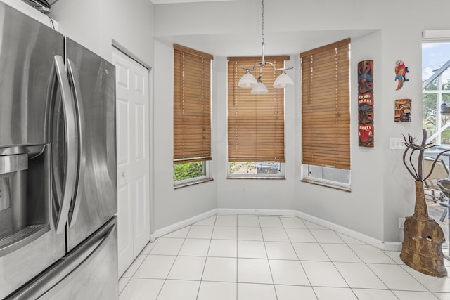 7997 Lakewood Cove Ct, Lake Worth, FL 33467 - unfurnished dining area featuring baseboards and a wealth of natural light