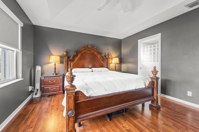 7997 Lakewood Cove Ct, Lake Worth, FL 33467 - bedroom featuring baseboards, wood finished floors, and visible vents