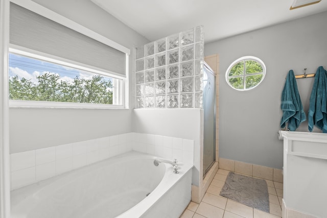 7997 Lakewood Cove Ct, Lake Worth, FL 33467 - full bath with tile patterned flooring, a shower stall, a healthy amount of sunlight, and a garden tub