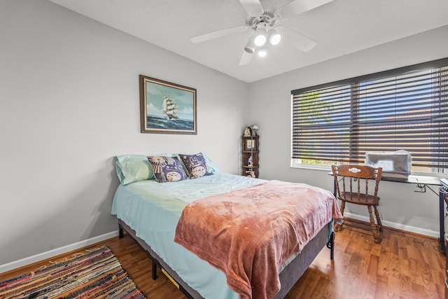 7997 Lakewood Cove Ct, Lake Worth, FL 33467 - bedroom with baseboards, ceiling fan, and wood finished floors