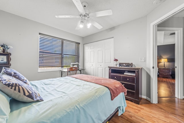 7997 Lakewood Cove Ct, Lake Worth, FL 33467 - bedroom featuring ceiling fan, a closet, light wood-type flooring, and visible vents