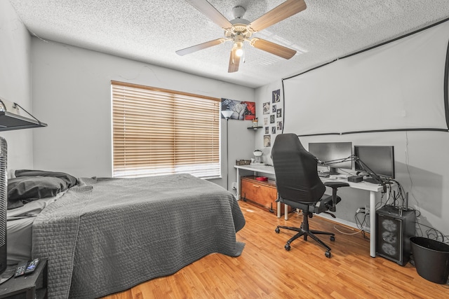 7997 Lakewood Cove Ct, Lake Worth, FL 33467 - bedroom with a ceiling fan, a textured ceiling, and wood finished floors