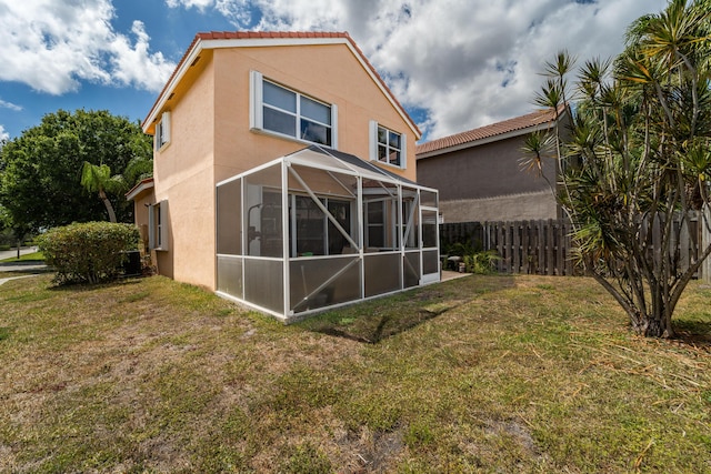 7997 Lakewood Cove Ct, Lake Worth, FL 33467 - rear view of property with a lawn, fence, and stucco siding