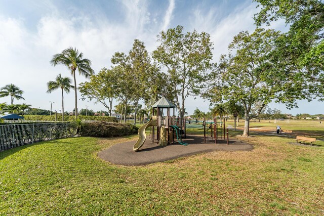 7997 Lakewood Cove Ct, Lake Worth, FL 33467 - communal playground with a lawn and fence