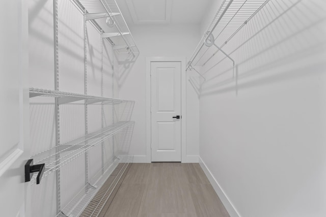 4665 SW Keats St, Port Saint Lucie, FL 34953 - walk in closet with wood finished floors