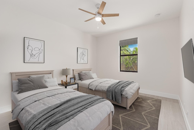 4665 SW Keats St, Port Saint Lucie, FL 34953 - bedroom featuring wood finished floors and a ceiling fan