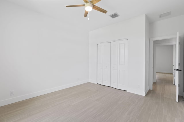 4665 SW Keats St, Port Saint Lucie, FL 34953 - unfurnished bedroom with baseboards, a closet, and light wood finished floors