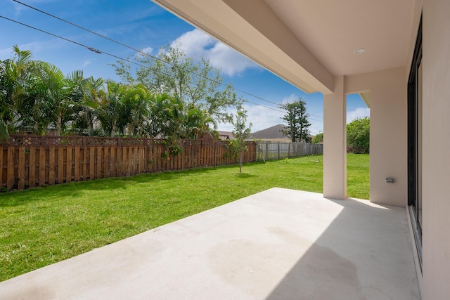 4665 SW Keats St, Port Saint Lucie, FL 34953 - fenced backyard with a patio area