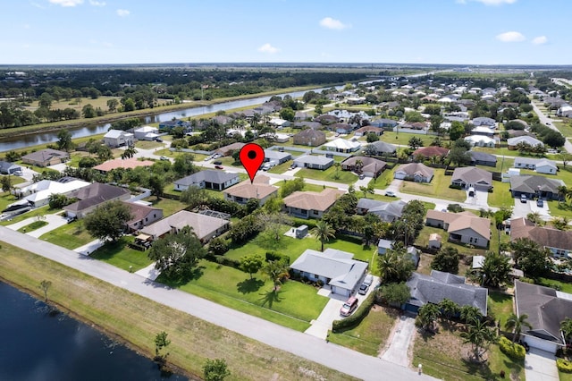 4665 SW Keats St, Port Saint Lucie, FL 34953 - aerial view of property's location featuring a nearby body of water and nearby suburban area