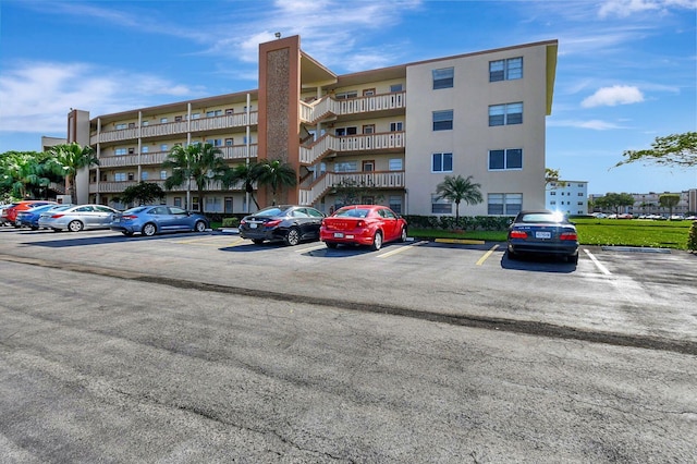view of property featuring uncovered parking