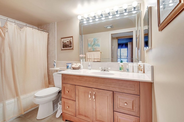 full bathroom featuring tile patterned flooring, shower / tub combo, toilet, and vanity