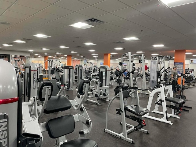 gym featuring visible vents and a drop ceiling