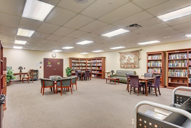 playroom with visible vents, a drop ceiling, and carpet