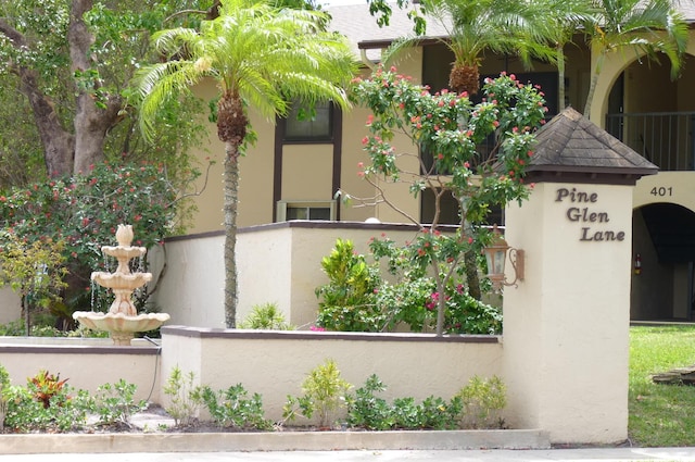 view of property exterior with fence private yard and stucco siding