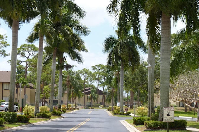 view of street featuring curbs and a residential view