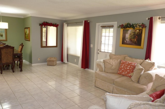 living room with baseboards, ornamental molding, and light tile patterned floors