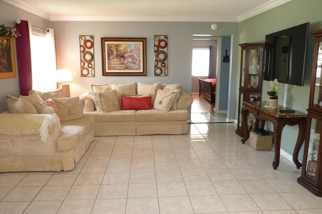 living room with ornamental molding and light tile patterned floors