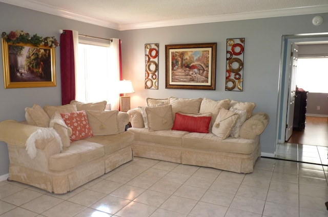 living room featuring light tile patterned floors, baseboards, ornamental molding, and a wealth of natural light