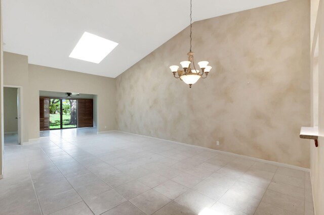 8449 Springlake Dr, Boca Raton, FL 33496 - foyer entrance with light tile patterned floors, baseboards, and lofted ceiling with skylight