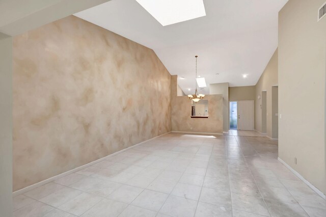 8449 Springlake Dr, Boca Raton, FL 33496 - kitchen featuring a skylight, appliances with stainless steel finishes, tasteful backsplash, a sink, and light tile patterned floors