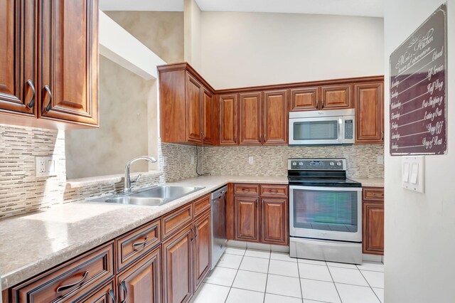 8449 Springlake Dr, Boca Raton, FL 33496 - laundry area featuring light tile patterned floors, laundry area, a textured ceiling, and washer and dryer