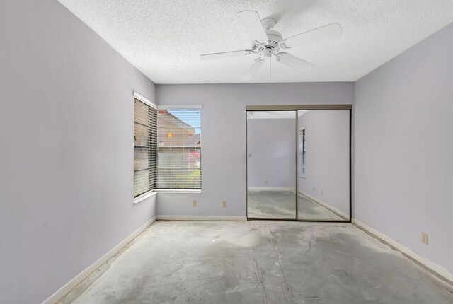 8449 Springlake Dr, Boca Raton, FL 33496 - rear view of property featuring stucco siding and a yard