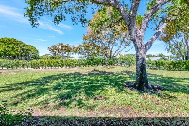 8449 Springlake Dr, Boca Raton, FL 33496 - dining space featuring baseboards, a textured ceiling, and visible vents