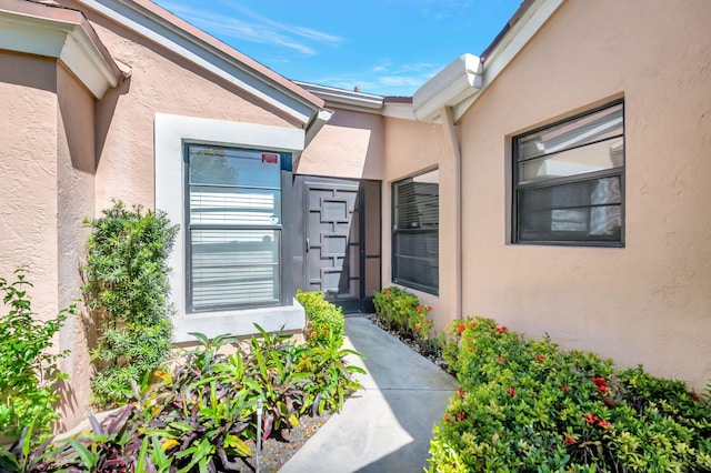 8449 Springlake Dr, Boca Raton, FL 33496 - view of exterior entry with stucco siding