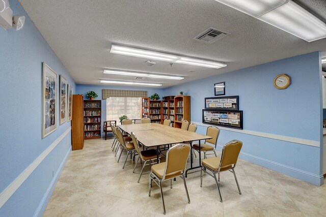 8449 Springlake Dr, Boca Raton, FL 33496 - view of property's community featuring a lawn, a carport, driveway, and shuffleboard
